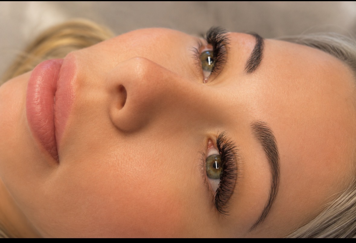 Close up of lash extensions and sculpted brows by Lashed Out Beauty Hub